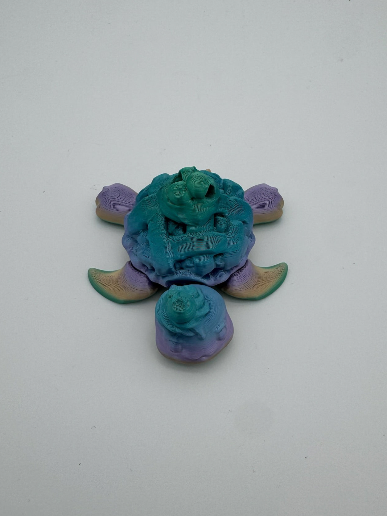Whimsical blueberry pie turtle desk toy crafted from 100% recycled plastic.
