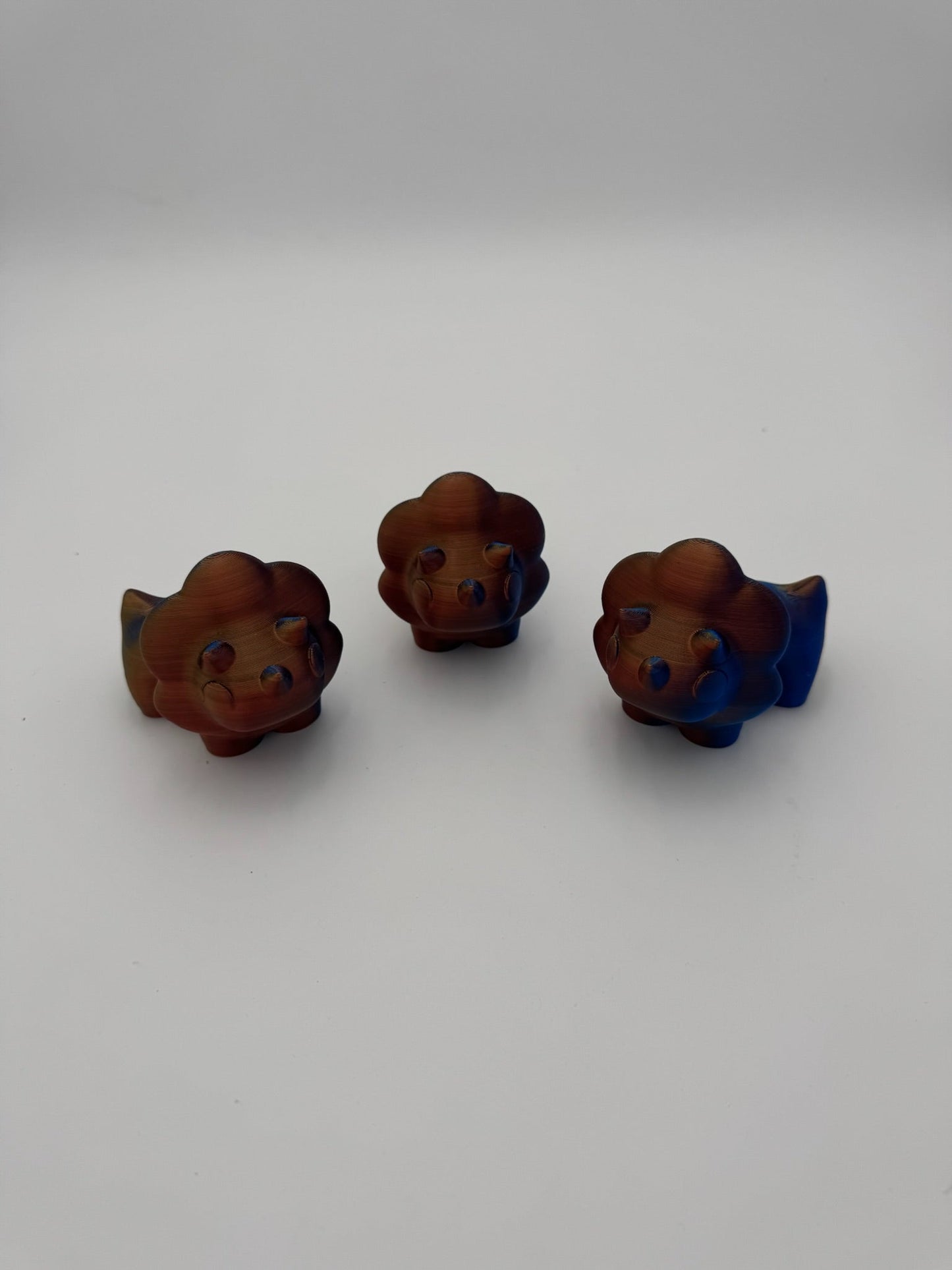 Hand-sized Tri Dino Mega Mini articulated dinosaur fidget toy.