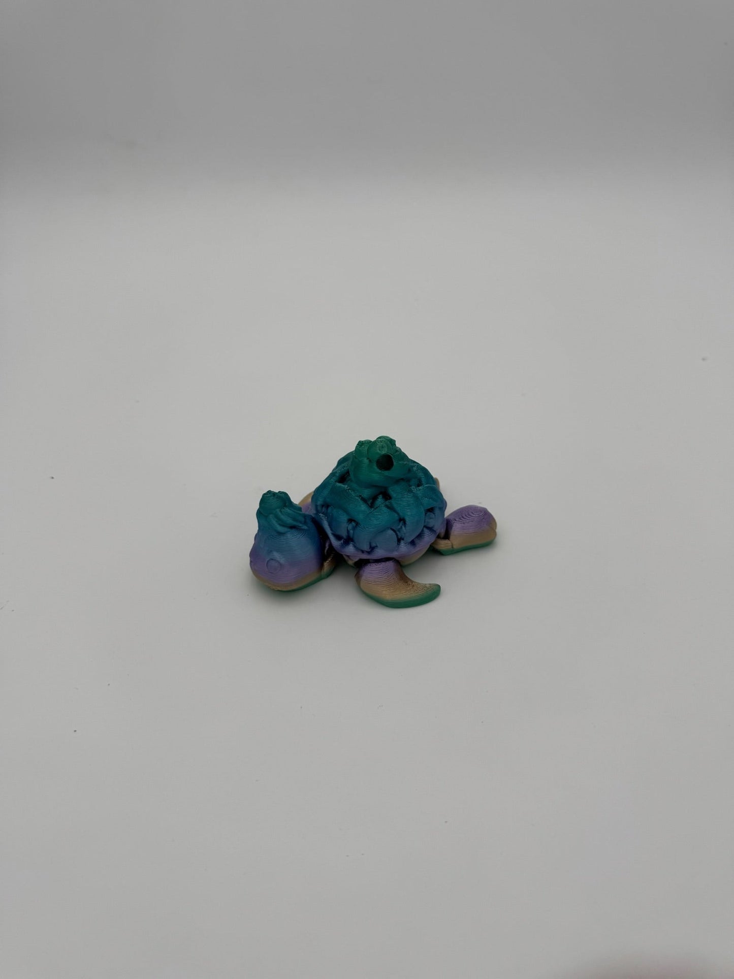 3D printed dessert-themed turtle collectible showcasing smooth joint articulation.