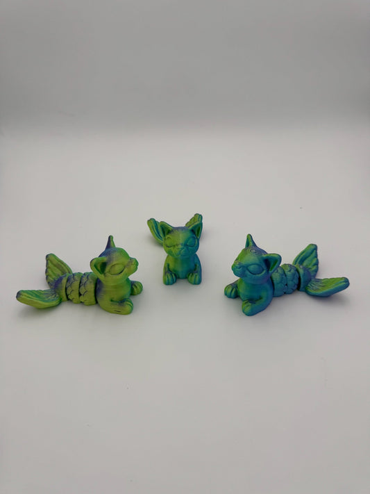 Hand-sized PurrMaid Mega Mini articulated cat-mermaid hybrid fidget toy.